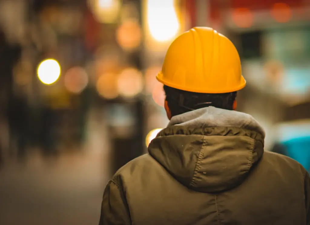 Construction professional wearing a yellow hard hat